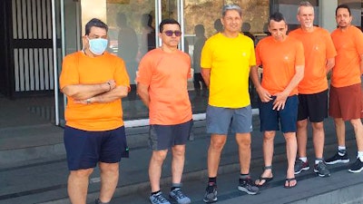 Left to right, Citgo oil executives Jose Angel Pereira, Gustavo Cardenas, Jorge Toledo, Jose Luis Zambrano, Tomeu Vadell and Alirio Jose Zambrano outside the Bolivarian National Intelligence Service, Caracas.