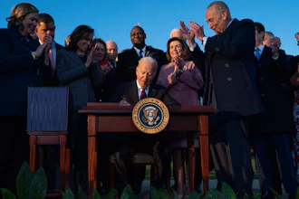 President Joe Biden signs the 'Infrastructure Investment and Jobs Act' during an event on the South Lawn of the White House, Nov. 15, 2021.