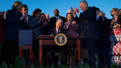 President Joe Biden signs the 'Infrastructure Investment and Jobs Act' during an event on the South Lawn of the White House, Nov. 15, 2021.