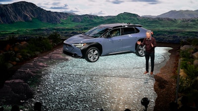 Tom Doll, president and CEO of Subaru of America Inc., introduces the 2023 Subaru Solterra EV at the AutoMobility LA auto show, Nov. 17, 2021, in Los Angeles.