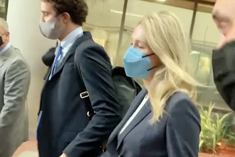 In this image take from video, Elizabeth Holmes leaves the U.S. Federal Courthouse in San Jose, Calif., Nov. 19, 2021.