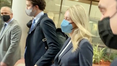 In this image take from video, Elizabeth Holmes leaves the U.S. Federal Courthouse in San Jose, Calif., Nov. 19, 2021.