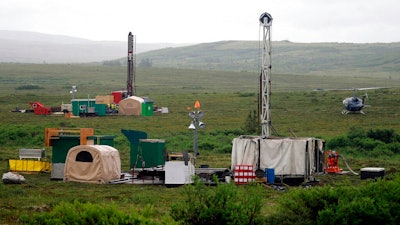 Workers with the Pebble Mine project test drill in the Bristol Bay region of Alaska, near the village of Iliamma, on July 13, 2007. The U.S. Environmental Protection Agency announced Wednesday, Nov. 17, 2021, it is extending through May a timeline to decide how or whether to proceed with proposed restrictions on mining in Alaska's Bristol Bay region, which is known for its salmon runs.