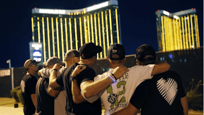 Survivors return to the scene of a mass shooting on its first anniversary in Las Vegas, Oct. 1, 2018.