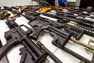 A variety of military-style semi-automatic rifles obtained during a buy back program displayed at Los Angeles police headquarters, Dec. 27, 2012.