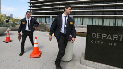 FBI agents leave the headquarters of the Los Angeles Department of Water and Power, July 22, 2019.