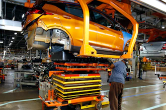 A battery is lifted into place for installation in a Chevrolet Bolt EV at the General Motors Orion Assembly plant, Nov. 4, 2016, Orion Township, Mich.