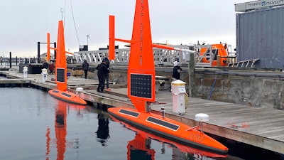 A Saildrone Explorer ocean drone is prepared for launch, Newport, R.I., Dec. 8, 2021.