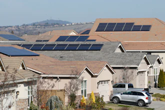 Solar panels on rooftops of a housing development in Folsom, Calif., Feb. 12, 2020.