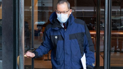 Harvard University Professor Charles Lieber leaves federal court, Boston, Dec. 14, 2021.