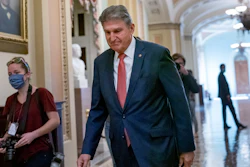 Sen. Joe Manchin, D-W.Va., walks to a caucus lunch at the Capitol in Washington, Dec. 17, 2021.