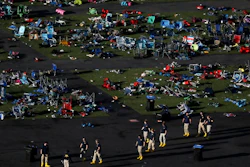 Investigators work at a festival grounds across the street from the Mandalay Bay Resort and Casino on Oct. 3, 2017, in Las Vegas after a mass shooting. The Nevada Supreme Court cited a state law that shields gun manufacturers from liability unless the weapon malfunctions in a new ruling that says they cannot be held responsible for the deaths in the 2017 mass shooting on the Las Vegas Strip.