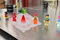 Time reversal technique focuses wave energy to knock over minifig targets in museum demonstration.