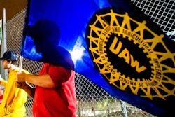 A General Motors employee who works on the line, waves a United Auto Workers flag as employees leave the Flint Assembly Plant at midnight as part of the national strike on, Sept. 16, 2019, in Flint, Mich. Members of the United Auto Workers union appear to be in favor of picking their leaders in direct elections. A federal court-appointed monitor who is conducting the election said on his website Wednesday, Dec. 1, 2021, that 65,136 ballots were cast in favor of direct elections, while 38,503 wanted delegate voting. The results are unofficial and the full count likely won't be done until Thursday, the website said.