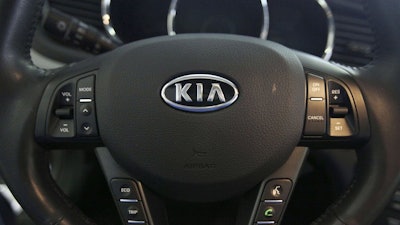 Steering wheel inside of a Kia car at a dealership in Elmhurst, Ill., Oct. 5, 2012.