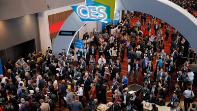 Crowds enter the convention center on the first day of the CES tech show, Las Vegas, Jan. 7, 2020.