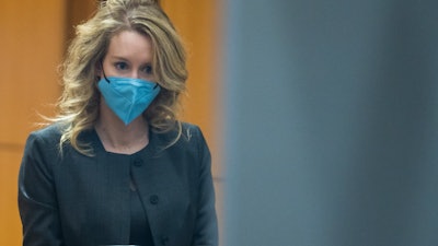 Elizabeth Holmes walks into federal court in San Jose, Calif., Jan. 3, 2022.