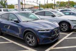 A pair of 2021 Ford Mustang Mach E displayed at a Ford dealer, Wexford, Pa., May 6, 2021.