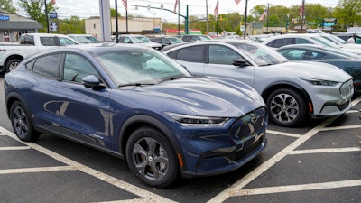 A pair of 2021 Ford Mustang Mach E displayed at a Ford dealer, Wexford, Pa., May 6, 2021.