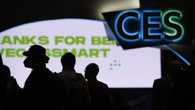 Attendees wait for the main show floor to open at the CES tech show, Las Vegas, Jan. 5, 2022.