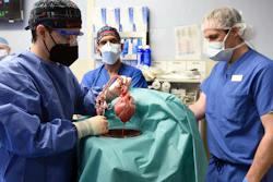 Members of the surgical team show the pig heart for transplant into patient David Bennett, Baltimore, Jan. 7, 2022.