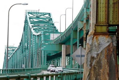 Drivers take an exit ramp off the Tobin Memorial Bridge on March 31, 2021, in Chelsea, Mass.