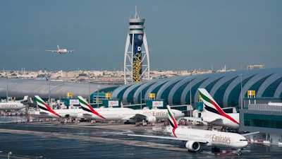 An Emirates jetliner comes in for landing at the Dubai International Airport, Dec. 11, 2019.