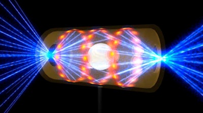 Illustration depicting a target pellet inside a hohlraum capsule with laser beams entering through openings on either end.