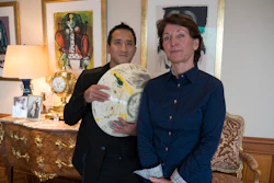Marina Picasso, right, and Florian Picasso pose with a ceramic work of Pablo Picasso, Cologny, Switzerland, Jan. 25, 2022.