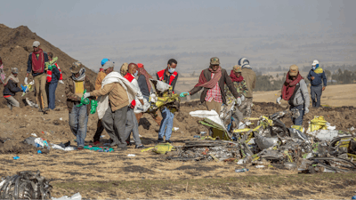 Rescuers work at the scene of an Ethiopian Airlines crash near Bishoftu, Ethiopia, March 11, 2019.