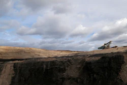 In this file photo taken on Thursday, Nov. 12, 2015 near the town of Most, Czech Republic, a huge excavator stands inside a giant open pit lignite mine. On Friday Jan. 7, 2022, the new Czech government pledged to work for the country to be able to phase out coal as an energy source by 2033.