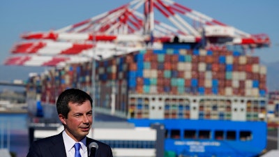 Transportation Secretary Pete Buttigieg speaks during a news conference to discuss the supply chain issues at the Port of Long Beach in Long Beach, Calif., Tuesday, Jan. 11, 2022.