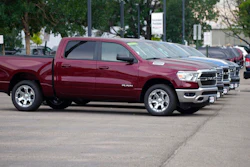 Only a handful of unsold 2021 Ram pickup trucks sit on the empty storage lot outside a Ram dealership on Sunday, Aug. 29, 2021, in Littleton, Colo.