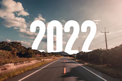 The Word 2022 Behind The Tree Of Empty Asphalt Road At Golden Sunset And Beautiful Blue Sky 1300086148 2125x1417 (1)