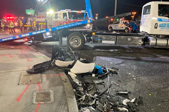 Authorities prepare to tow a vehicle involved a deadly six-car crash in North Las Vegas, Nevada, Jan. 30, 2022.