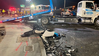 Authorities prepare to tow a vehicle involved a deadly six-car crash in North Las Vegas, Nevada, Jan. 30, 2022.