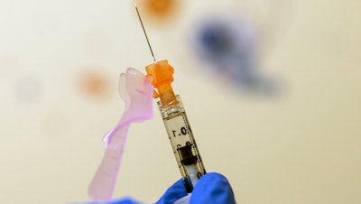 A nurse prepares a COVID-19 vaccine dose at Children's National Hospital in Washington, Nov. 3, 2021.