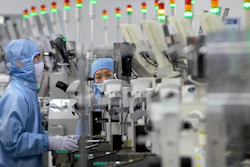 Employees at a Renesas Electronics semiconductor production facility, Beijing, May 14, 2020.