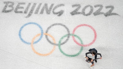Karina Safina and Luka Berulava of Gerogia compete during the pairs short program figure skating competition at the 2022 Winter Olympics, Beijing, Feb. 4, 2022.