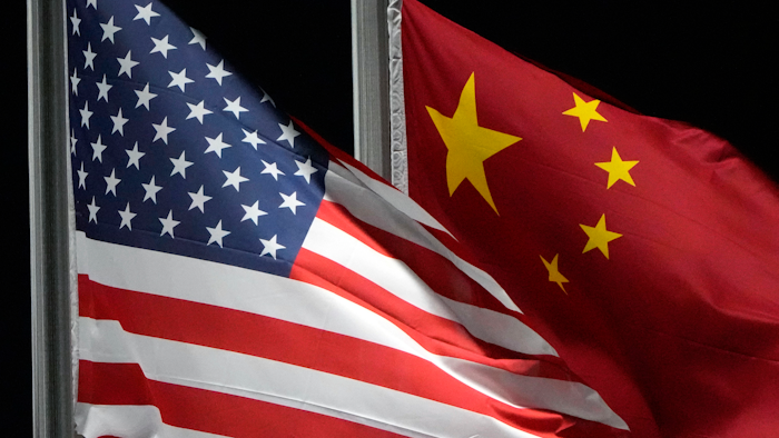 American and Chinese flags wave at Genting Snow Park, Zhangjiakou, China, Feb. 2, 2022.