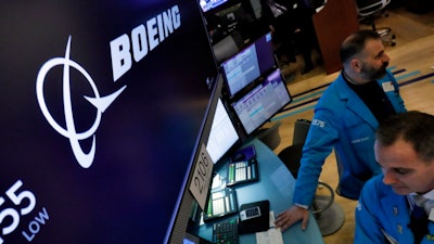 The Boeing logo above a trading post on the floor of the New York Stock Exchange, March 12, 2020.