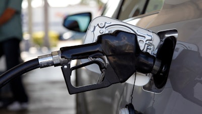 Fuel is pumped into a vehicle in Miami, June 14, 2012.