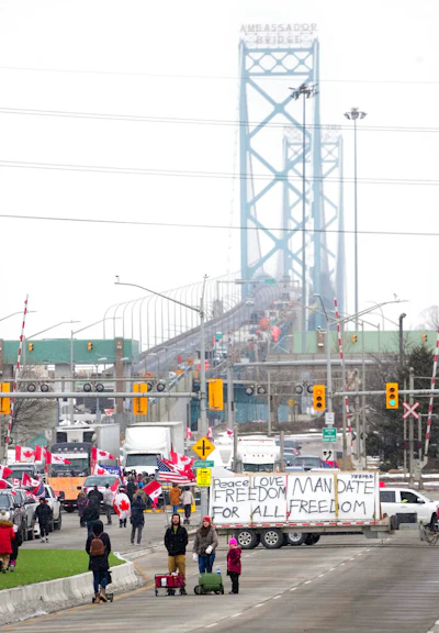 Truckers and supporters block the access leading from the Ambassador Bridge, linking Detroit and Windsor, as truckers and their supporters continue to protest against COVID-19 vaccine mandates and restrictions, in Windsor, Ontario on Feb. 10, 2022.