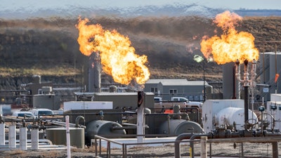 Flares burn on the Fort Berthold Indian Reservation in North Dakota, Oct. 27, 2021.