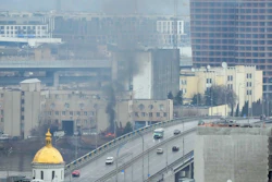 Smoke and flame rise near a military building after an apparent Russian strike in Kyiv, Ukraine, Feb. 24, 2022.