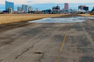 Pot-holed runway at the former Bader Field airport site in Atlantic City, N.J., Feb. 18, 2022.