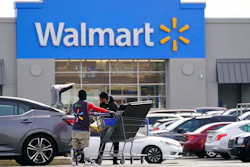 Shown is a Walmart location in Philadelphia, Wednesday, Nov. 17, 2021. Walmart is reporting strong fiscal fourth-quarter results that exceeded analysts' expectations as the nation's largest retailer defies higher inflation and supply chain issues. Walmart said Thursday, Feb. 17, 2022, that net income was $3.56 billion, or $1.28 per share in the quarter ended Jan. 31. That compares with a loss of $2.91 billion, or loss of 74 cents. Revenue was $151.5 billion.
