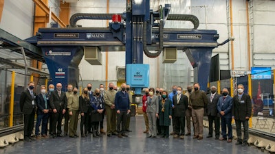 U.S. Sens. Susan Collins and Angus King, U.S. Department of Defense leadership, and University of Maine officials at an event celebrating the production of the world’s largest 3D-printed logistics vessel, Feb. 25, 2022.