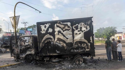 A burnt out truck after street battles between gunmen and security forces in Culiacan, Mexico, Oct. 18, 2019.
