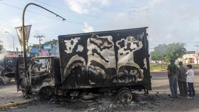 A burnt out truck after street battles between gunmen and security forces in Culiacan, Mexico, Oct. 18, 2019.